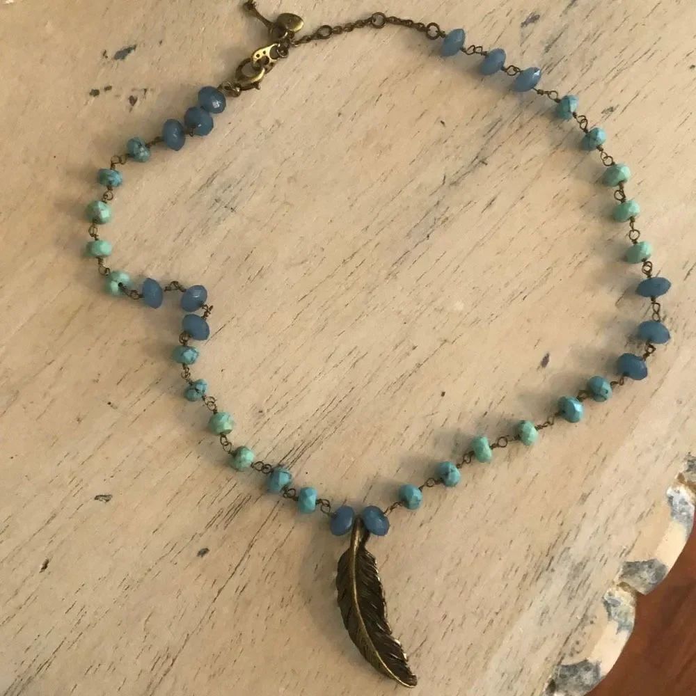 Fossil Gold leaf necklace with turquoise color stone